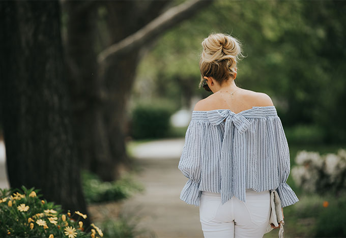 chic wash top with bow back detail